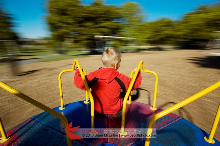 Boy on Spinning Merry-Go-Round